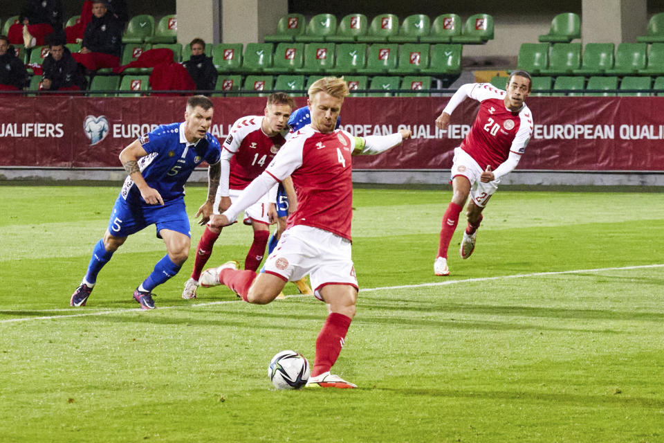 FILE - Denmark's Simon Kjaer scores his side's second goal from the penalty spot during the World Cup 2022, group F qualifying soccer match between Moldova and Denmark, at the Zimbru stadium in Chisinau, Moldova, Saturday, Oct. 9, 2021. (AP Photo/Aurel Obreja, File)