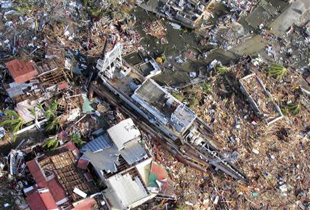 An aerial view of devastation and a ship after it was swept at the height of super typhoon Haiyan in Tacloban city