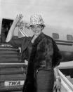 <p>Actress Jane Russell sported a chic airport look as she departed from London, decked out in a fur coat, ornate hat, and several bracelets. Is this why it's called a runway?<br></p>