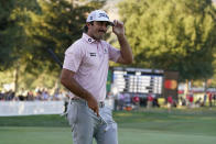 Max Homa acknowledges the crowd on the 18th green of the Silverado Resort North Course after finishing the final round of the Fortinet Championship PGA golf tournament Sunday, Sept. 19, 2021, in Napa, Calif. Homa won the tournament. (AP Photo/Eric Risberg)