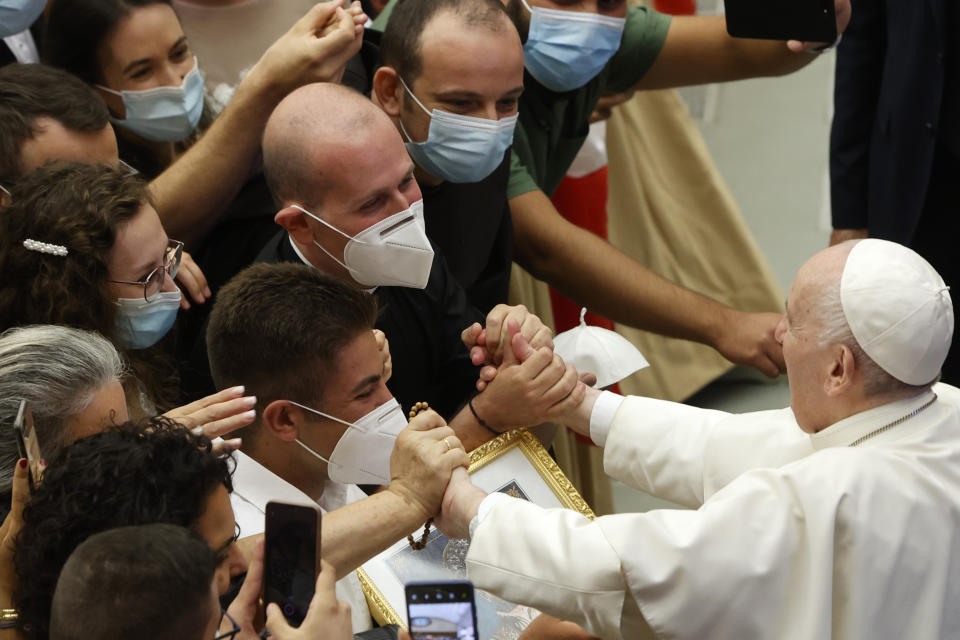 Pope Francis greets the faithful at the end of his weekly general audience in the Paul VI hall at the Vatican, Wednesday, Aug. 11, 2021. (AP Photo/Riccardo De Luca)