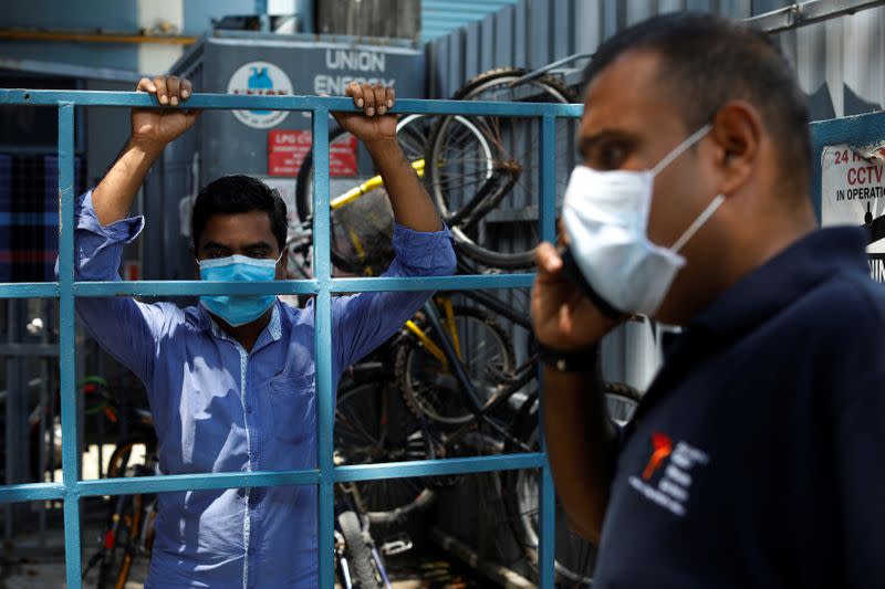 Reverend Samuel Gift Stephen calls a restaurant owner after hearing feedback from a migrant worker about the food delivered to them during the coronavirus disease (COVID-19) outbreak in Singapore