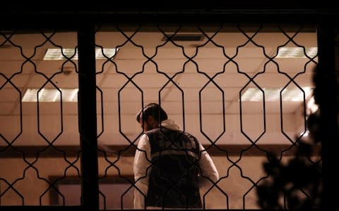 A Turkish forensic police officer shoots video in a room of the Saudi Arabia's Consulate - Credit: (AP Photo/Emrah Gurel)