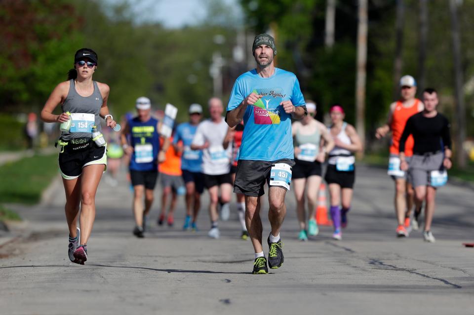 Participants compete in the Cellcom Green Bay Marathon on Sunday in Green Bay.