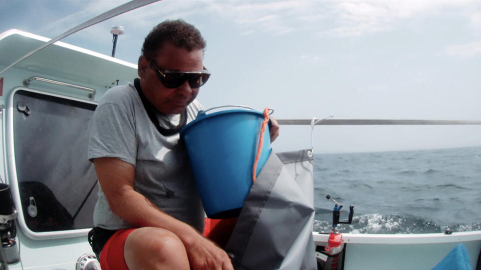 Craig Charles clutches his sick bucket on 'Don't Rock The Boat'. (ITV)