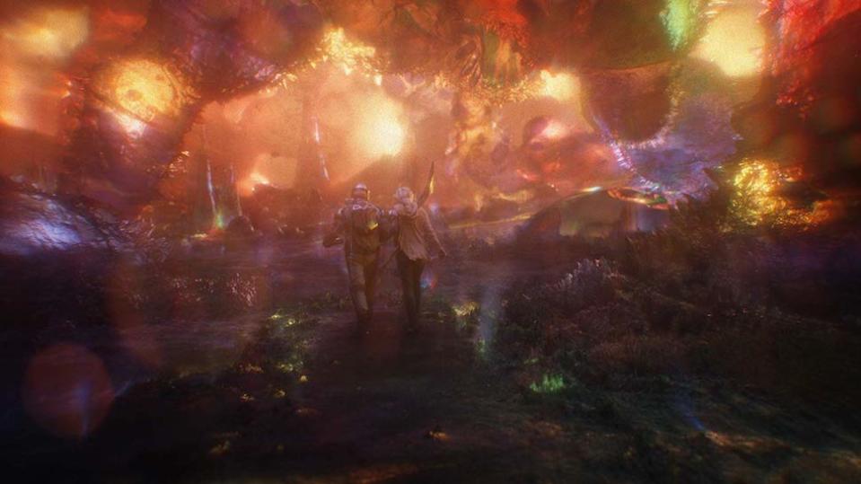 Two people walk through the surreal colorful world of the quantum realm in ant-man and the wasp