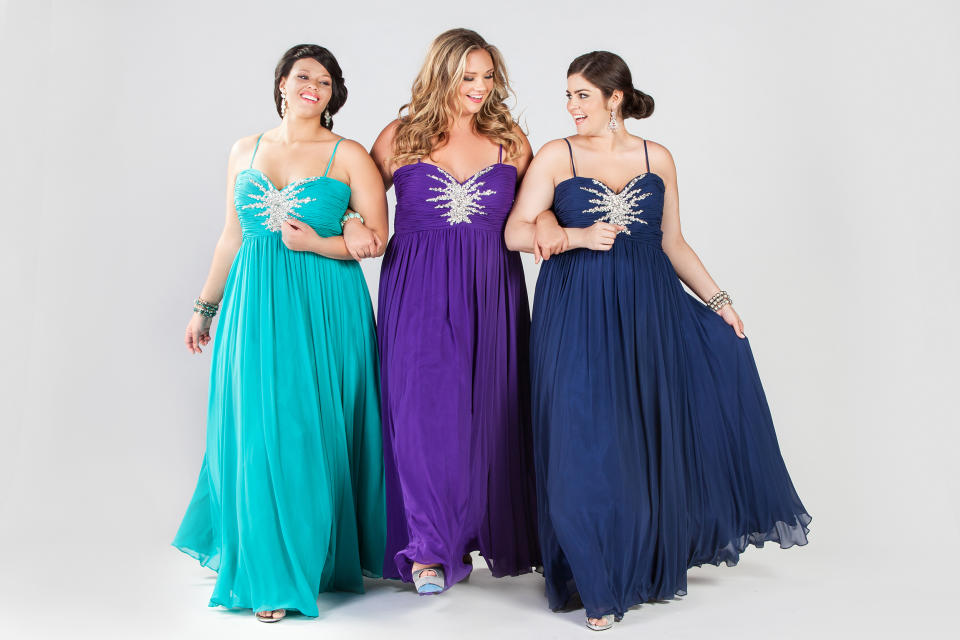 This product image released by Sydney’s Closet shows women modeling plus size prom dresses. Clothes shopping for plus-size teens can be frustrating in general, but shopping for a dream prom dress can be a tear-inducing, hair-pulling morass of bad design and few options _ especially for girls who want a dress that hugs the body instead of tenting it. (AP Photo/Sydney’s Closet)