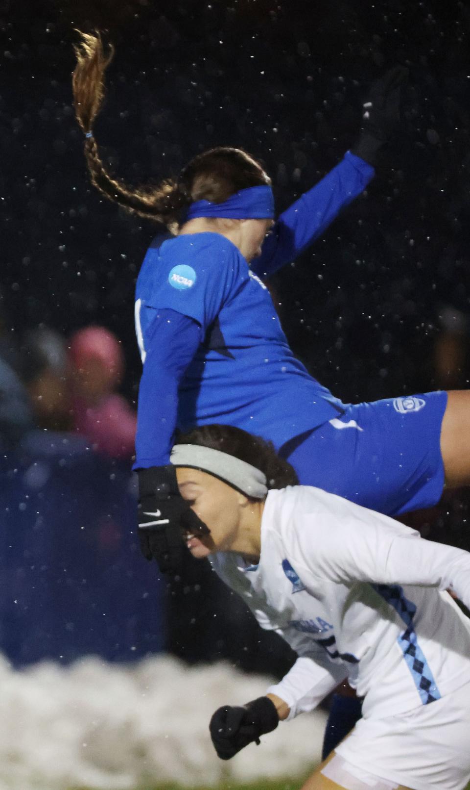 BYU midfielder Bella Folino (22) falls over North Carolina’s Mia Oliaro (22) during the NCAA tournament quarterfinals in Provo on Friday, Nov. 24, 2023. | Jeffrey D. Allred, Deseret News