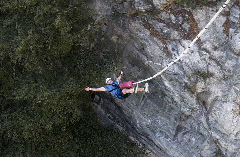 A bungee jumper does a backward plunge off the Bridge To Nowhere on October 16, 2016 in San Gabriel Mountains