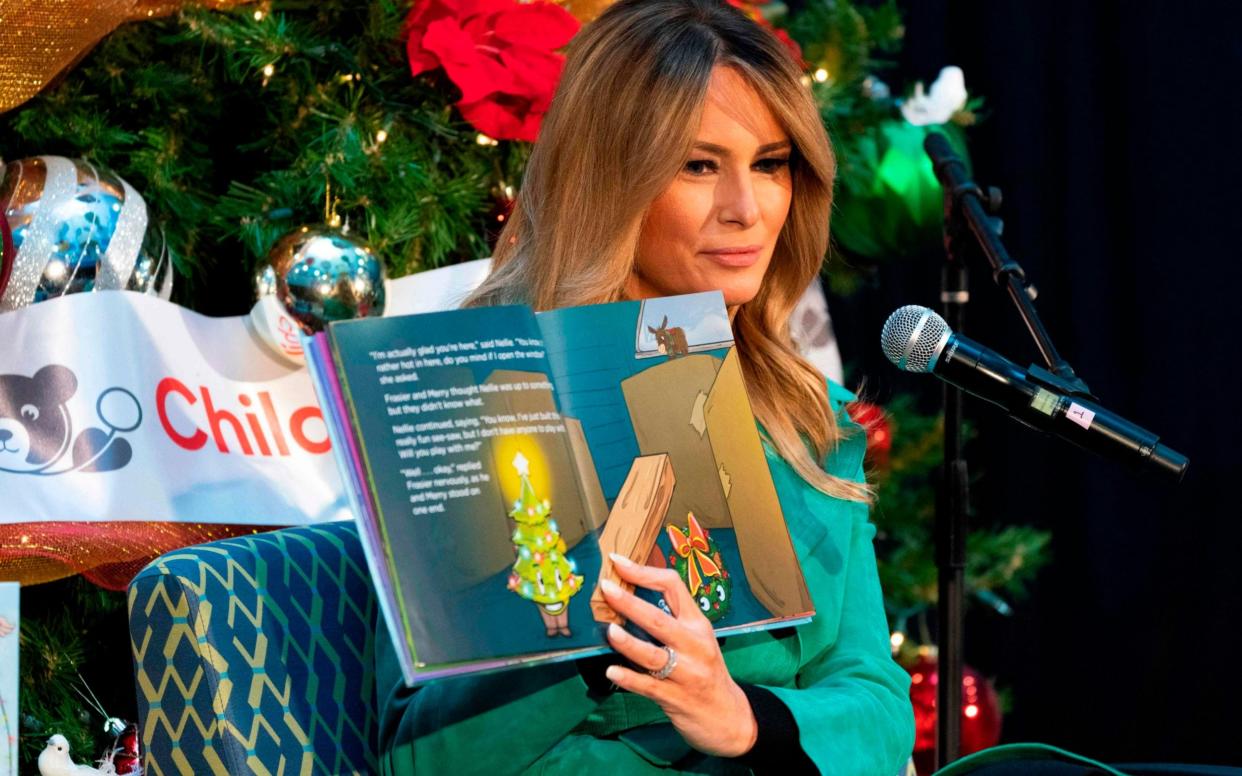 The First Lady removed her mask while reading to a group of children at the Children’s National Hospital in Washington DC  - JACQUELYN MARTIN /AFP