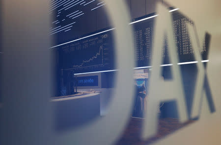 The German share prize index DAX board is reflected in a glass facade on the day of the Brexit deal vote of the British parliament in Frankfurt, Germany, January 15, 2019. REUTERS/Kai Pfaffenbach/Files