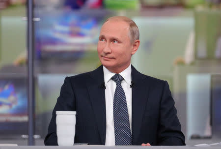 Russian President Vladimir Putin attends a live nationwide broadcast call-in in Moscow, Russia June 7, 2018. Sputnik/Alexei Druzhinin/Kremlin via REUTERS