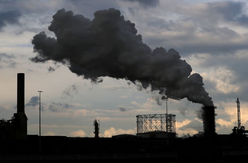 FILE PHOTO: Smoke is seen coming out of a chimney at the Tata steel plant in Ijmuiden