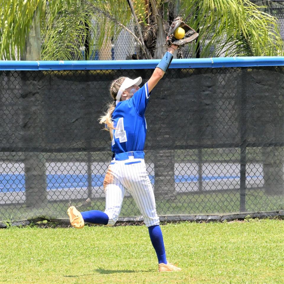 Wellington's Kaitlyn Campbell ranges back for an impressive catch in left-centerfield, preventing a run from scoring in the Wolverines' regional final (May 20, 2023).
