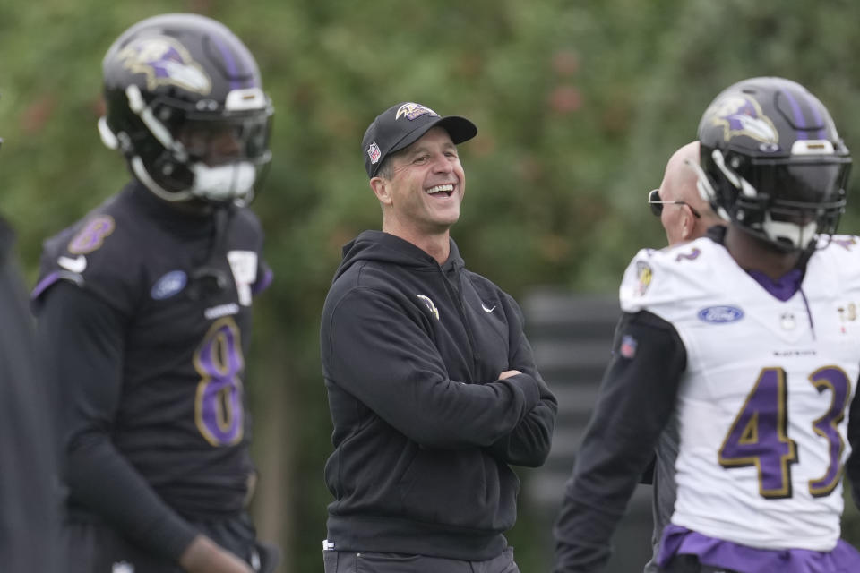 Baltimore Ravens head coach John Harbaugh, center, attends an NFL practice session in London, Thursday, Oct. 12, 2023 ahead the NFL game against Tennessee Titans at the Tottenham Hotspur Stadium on Sunday. (AP Photo/Kin Cheung)