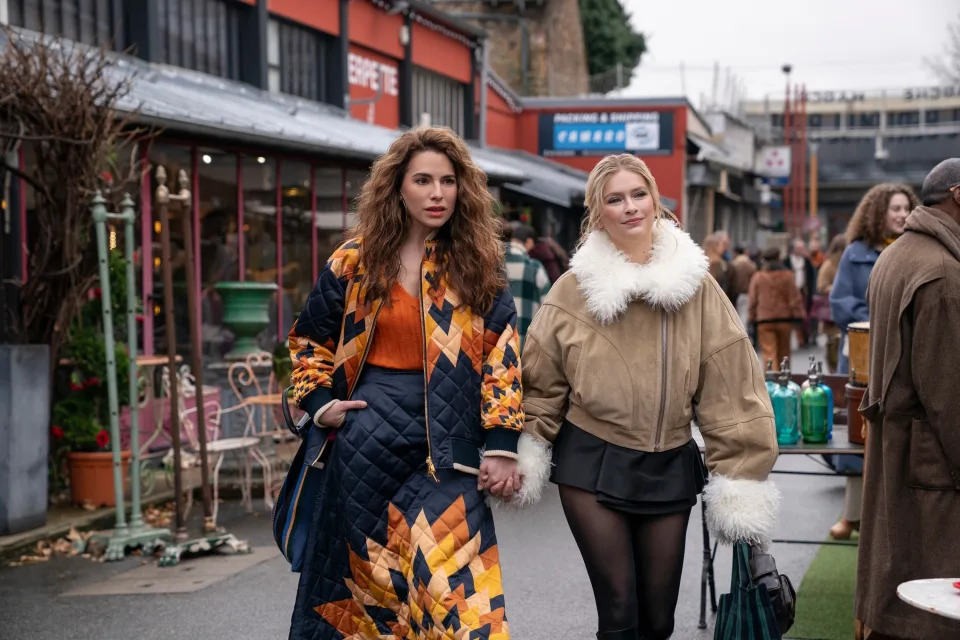 Melia Kreiling and Camille Razat exploring a market in "Emily in Paris"