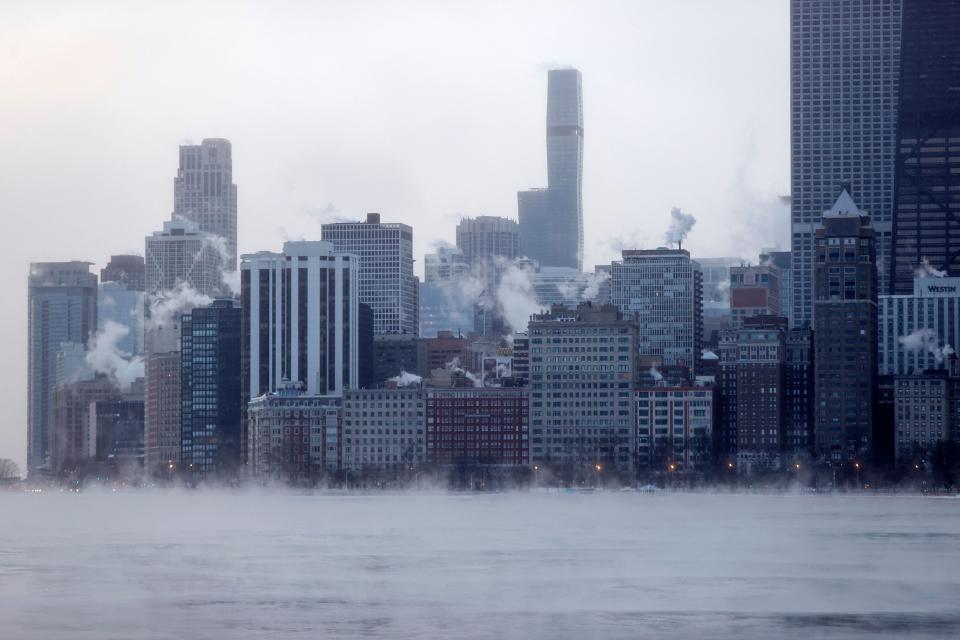Mist rises from the ‘windy’ city of Chicago on the edge of Lake Michigan at sunrise on December 23, 2022, where temperatures reached -6F (-21C), ahead of the Christmas Holiday (AFP via Getty Images)