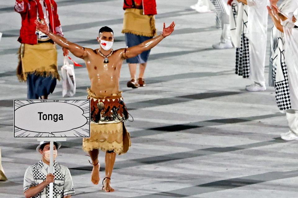 Pita Taufatofua walks during the opening ceremony for the Tokyo Olympics.