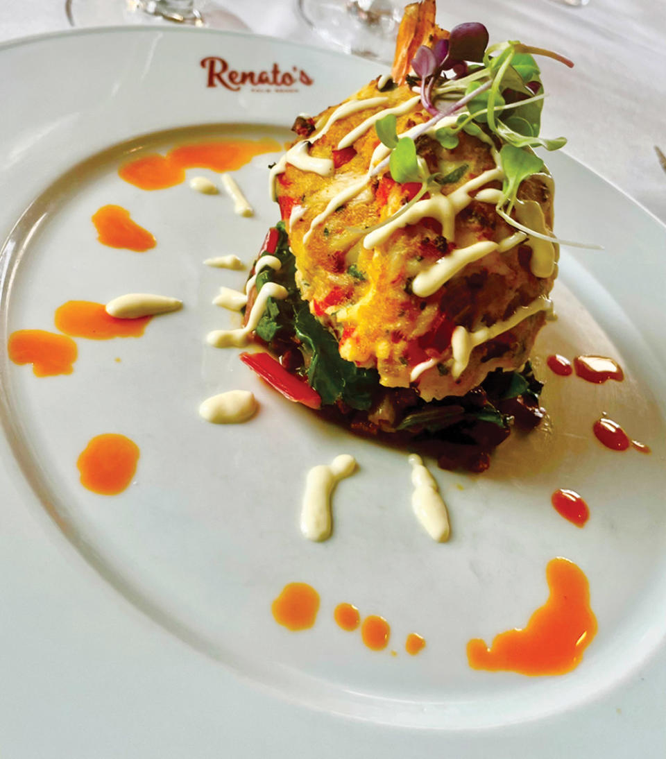 Crab cake with sautéed spinach dish at Italian spot Renato’s in Palm Beach.