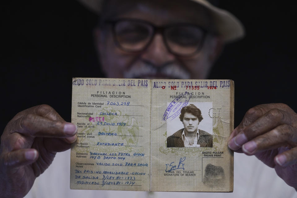 Chilean exile Sergio Naranjo shows his old, Chilean passport marked with the Spanish instruction: "Only valid to leave the country", in Mexico City, Thursday, Aug. 3, 2023. Naranjo, 69, was a member of Chile's Revolutionary Left Movement and became a political exile on May 17, 1975 when he left a detention center and was expelled from Chile, landing in Mexico, following the military coup by Gen. Augusto Pinochet that ousted and killed Salvador Allende on Sept. 11, 1973. (AP Photo/Marco Ugarte)