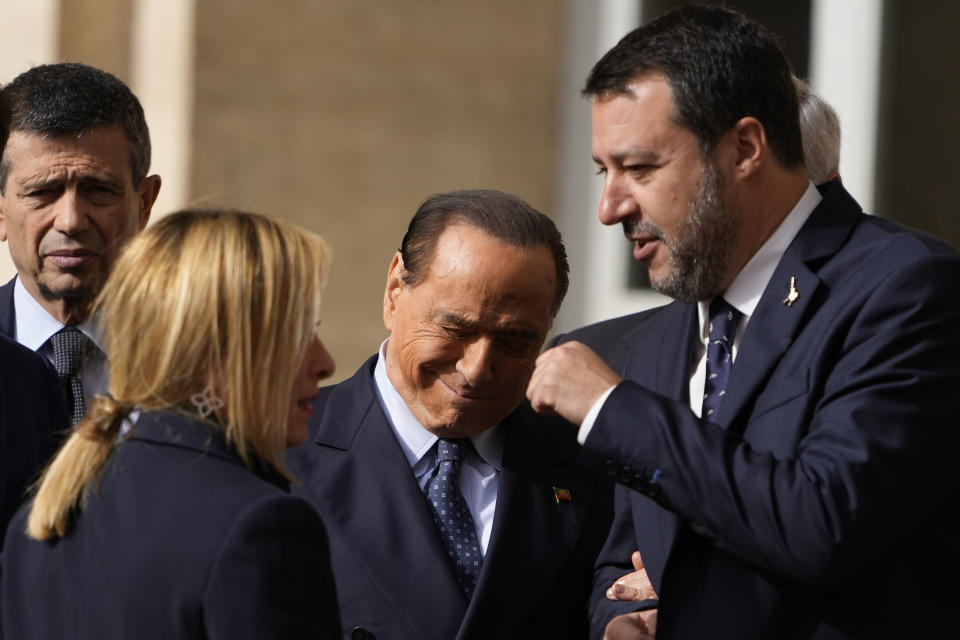 Forza Italia president Silvio Berlusconi, center, talks with Brothers of Italy's leader Giorgia Meloni and The League leader Matteo Salvini, as they leave the Quirinale Presidential Palace after a meeting with Italian President Sergio Mattarella as part of a round of consultations with party leaders to try and form a new government, in Rome, Friday, Oct. 21, 2022. (AP Photo/Alessandra Tarantino)