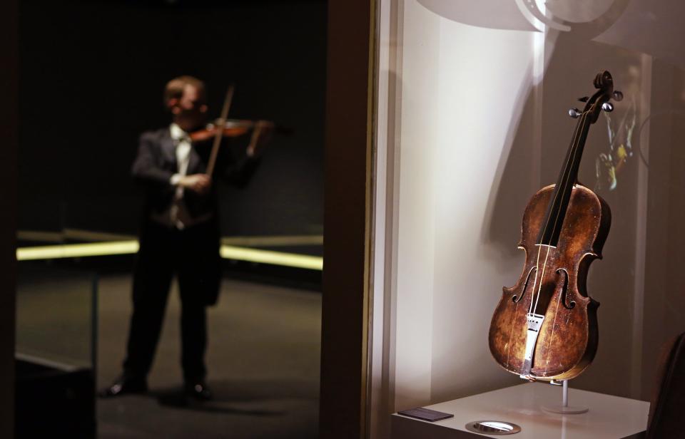 File photograph shows the violin that belonged to Titanic bandmaster Wallace Hartley on display at the Titanic Centre in Belfast