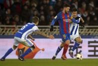 Football Soccer - Real Sociedad v Barcelona - Spanish King's Cup - Anoeta Stadium, San Sebastian Spain - 19/01/17 Barcelona's Lionel Messi and Real Sociedad's Yuri Berchiche and Inigo Martinez in action. REUTERS/Vincent West