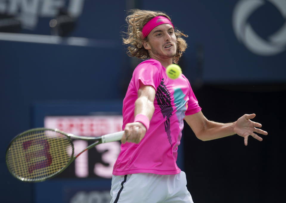 Stefanos Tsitsipas of Greece hits a forehand to Alexander Zverev of Germany during Rogers Cup quarterfinal tennis tournament action in Toronto on Friday, Aug. 10, 2018. (Frank Gunn/The Canadian Press via AP)