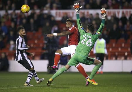 Britain Football Soccer - Nottingham Forest v Newcastle United - Sky Bet Championship - The City Ground - 2/12/16 Nottingham Forest’s Britt Assombalonga shoots past Newcastle’s Karl Darlow Mandatory Credit: Action Images / Andrew Couldridge Livepic