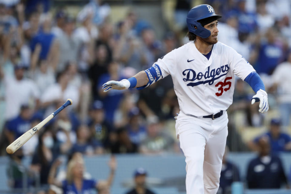 Los Angeles Dodgers' Cody Bellinger watches his game-winning solo home run against the Chicago Cubs during the ninth inning of a baseball game in Los Angeles, Saturday, June 26, 2021. (AP Photo/Alex Gallardo)