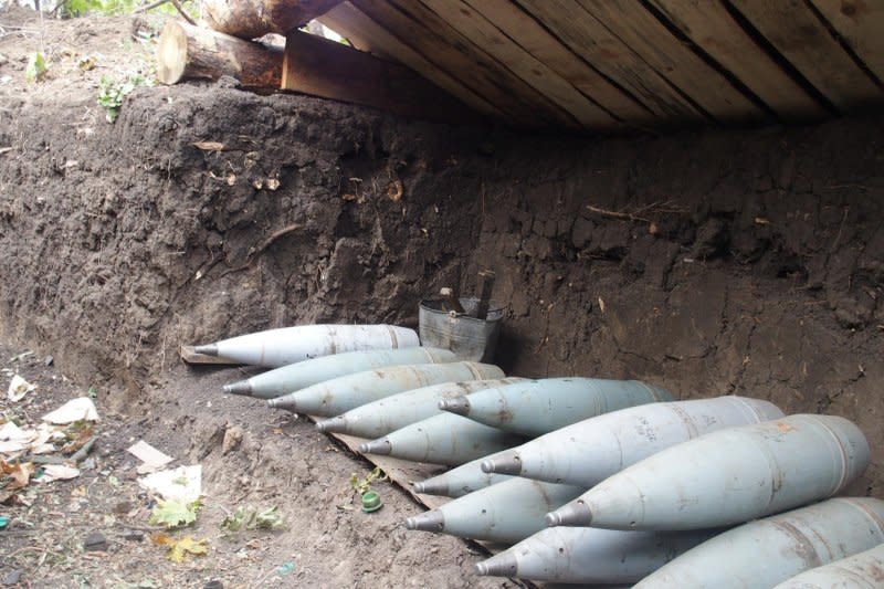 Ukrainian artillery shells line a trench along the Donetsk frontline. Photo by Patrick Hilsman/UPI