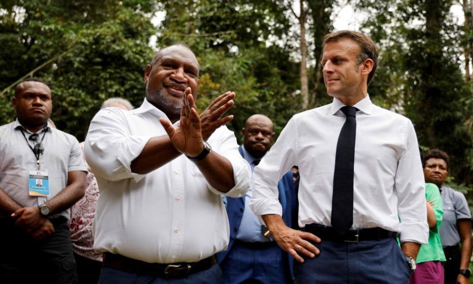 Papua New Guinea’s prime minister James Marape and France’s president Emmanuel Macron speak in Port Moresby on Friday.