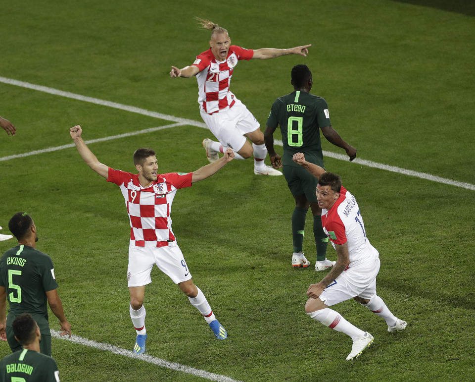 <p>Contrasting emotions: Croatia celebrate the goal, while Oghenekaro Etebo is left distraught. (AP) </p>
