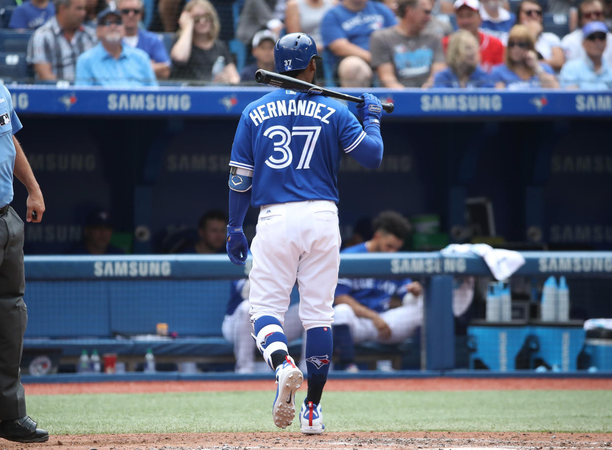 TORONTO, ON - AUGUST 22: Teoscar Hernandez #37 of the Toronto Blue Jays walks back to the dugout after striking out swinging to end the fifth inning during MLB game action against the Baltimore Orioles at Rogers Centre on August 22, 2018 in Toronto, Canada. (Photo by Tom Szczerbowski/Getty Images)