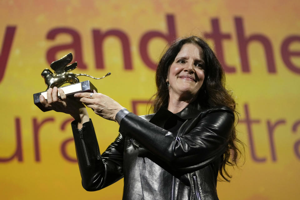 Director Laura Poitras holds the Golden Lion award for best film for 'All the Beauty and the Bloodshed' at the closing ceremony of the 79th edition of the Venice Film Festival in Venice, Italy, Saturday, Sept. 10, 2022. (AP Photo/Domenico Stinellis)