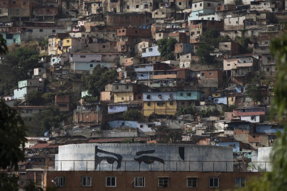 "Chavez's eyes”, a design based on the eyes of the late Venezuelan President Hugo Chavez, adorns a water tank of a government subsidized apartment building, in Caracas, Venezuela, Friday, March 3, 2023. A generation of children in Venezuela have only known a country in crisis, plagued over the last decade or more by shortages and inflation. They have also known only one president, Nicolás Maduro. He took over when his mentor Hugo Chávez died of cancer a decade ago on March 5, 2013. (AP Photo/Ariana Cubillos)