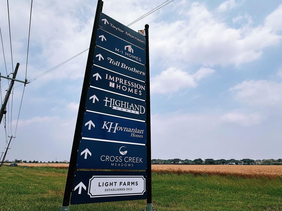 This sign, positioned near the town's entrance, showcases the array of homebuilders in Celina