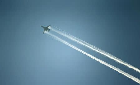 A U.S.-led coalition aircraft flying over Kobanii, as seen from near the Mursitpinar border crossing on the Turkish-Syrian border in the southeastern town of Suruc in Sanliurfa province October 15, 2014. REUTERS/Kai Pfaffenbach