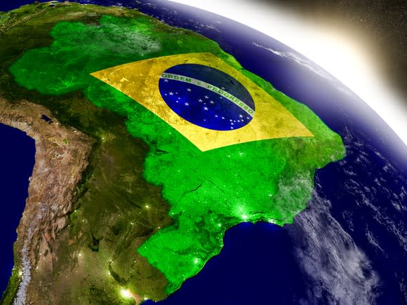 Brazilian flag superimposed over map of Brazil