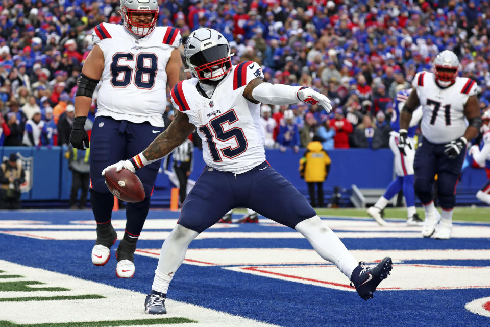 New England Patriots running back Ezekiel Elliott (15) spikes the football after scoring during the second half of an NFL football game against the Buffalo Bills in Orchard Park, N.Y., Sunday, Dec. 31, 2023. (AP Photo/Jeffrey T. Barnes )