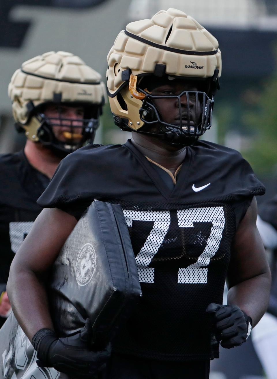 Purdue Boilermakers offensive lineman Mahamane Moussa (77) runs a drill Wednesday, July 31, 2024, during Purdue football practice at Bimel Outdoor Practice Complex in West Lafayette, Ind.