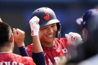 Japan's Hayato Sakamoto celebrates after hitting a home run during a baseball game against Mexico at Yokohama Baseball Stadium during the 2020 Summer Olympics, Saturday, July 31, 2021, in Yokohama, Japan. (AP Photo/Matt Slocum)