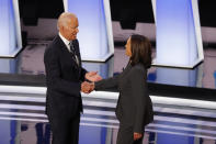 FILE - In this July 31, 2019, file photo, fFormer Vice President Joe Biden shakes hands with Sen. Kamala Harris, D-Calif., before the second of two Democratic presidential primary debates at the Fox Theatre in Detroit. Democratic presidential candidate former Vice President Joe Biden has chosen Harris as his running mate. (AP Photo/Paul Sancya, File)