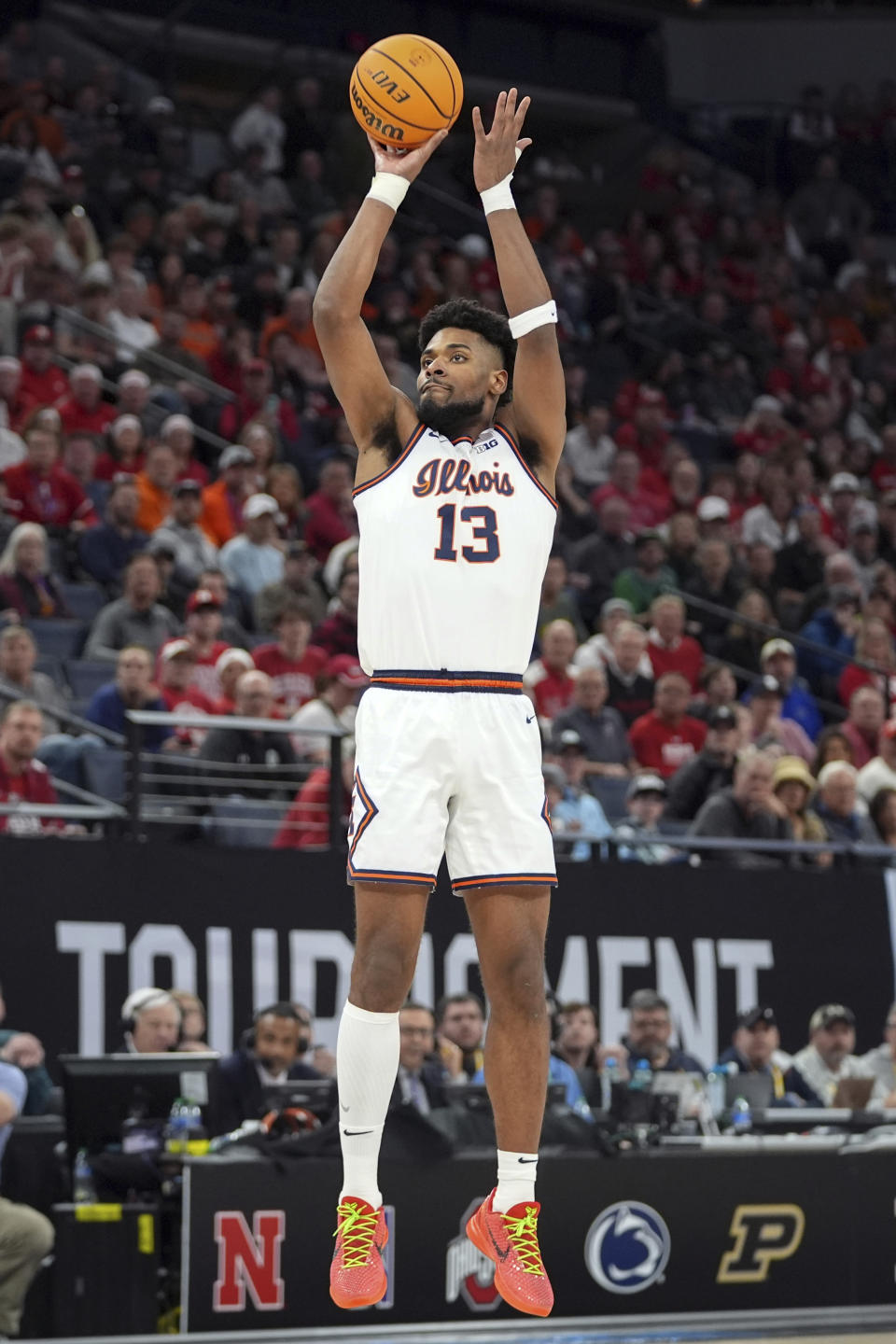 Illinois forward Quincy Guerrier (13) shoots during the first half of an NCAA college basketball game against Nebraska in the semifinal round of the Big Ten Conference tournament, Saturday, March 16, 2024, in Minneapolis. (AP Photo/Abbie Parr)