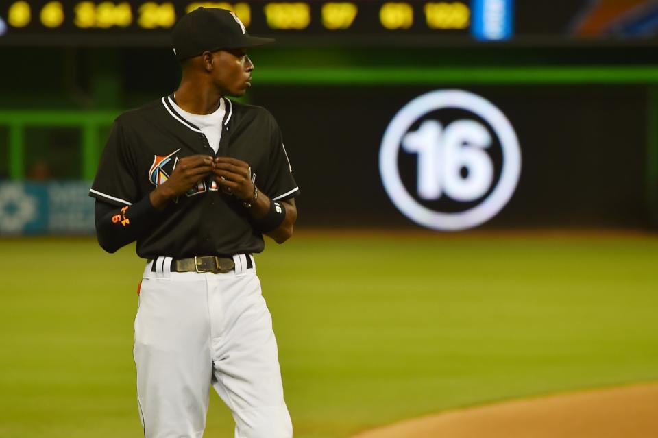 <p>Miami Marlins second baseman Dee Gordon walks on the field before the game between the Miami Marlins and the New York Mets at Marlins Park. Mandatory Credit: Jasen Vinlove-USA TODAY Sports </p>