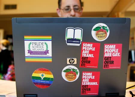 Director and Co-Founder Christian Zsilavetz, of the Pride School does work from his computer covered in stickers in Atlanta, Georgia, U.S. on December 7, 2016. The Pride School is a K-12 school for LGBT+ students and others that benefit from alternative educational resources. REUTERS/Tami Chappell