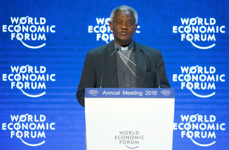 FILE PHOTO: Cardinal Peter K. A. Turkson, President of the Pontifical Council for Justice and Peace addresses the attendees during the Annual Meeting 2016 of the World Economic Forum (WEF) in Davos, Switzerland January 20, 2016. REUTERS/Ruben Sprich