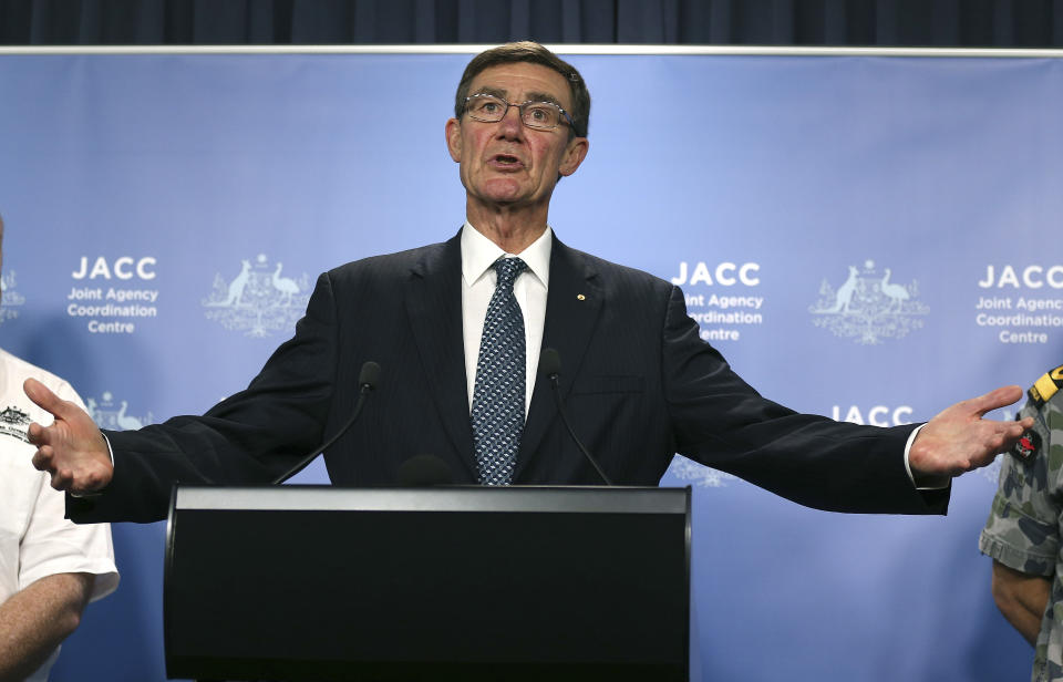 The chief coordinator of the Joint Agency Coordination Center retired Chief Air Marshal Angus Houston gestures as he speaks at a press conference about the ongoing search operations for missing Malaysia Airlines Flight 370 in Perth, Australia, Monday, April 14, 2014. Houston said search crews will send a robotic submarine deep into the Indian Ocean on Monday for the first time to try to determine whether underwater signals detected by sound-locating equipment are from the missing Malaysian plane's black boxes. (AP Photo/Rob Griffith)