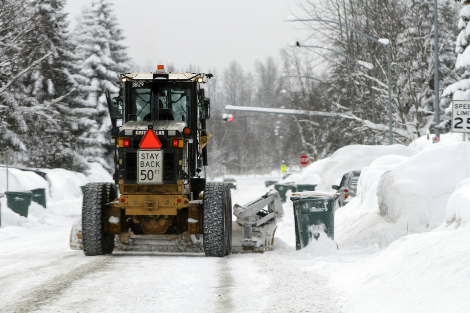 A plow clears a residential street, Monday, Jan. 29, 2024, in Anchorage, Alaska. (AP Photo/Mark Thiessen)