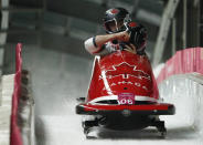 Bobsleigh - Pyeongchang 2018 Winter Olympics - Men's 2-man Finals - Olympic Sliding Centre - Pyeongchang, South Korea - February 19, 2018 - Alexander Kopacz and Justin Kripps of Canada react. REUTERS/Edgar Su